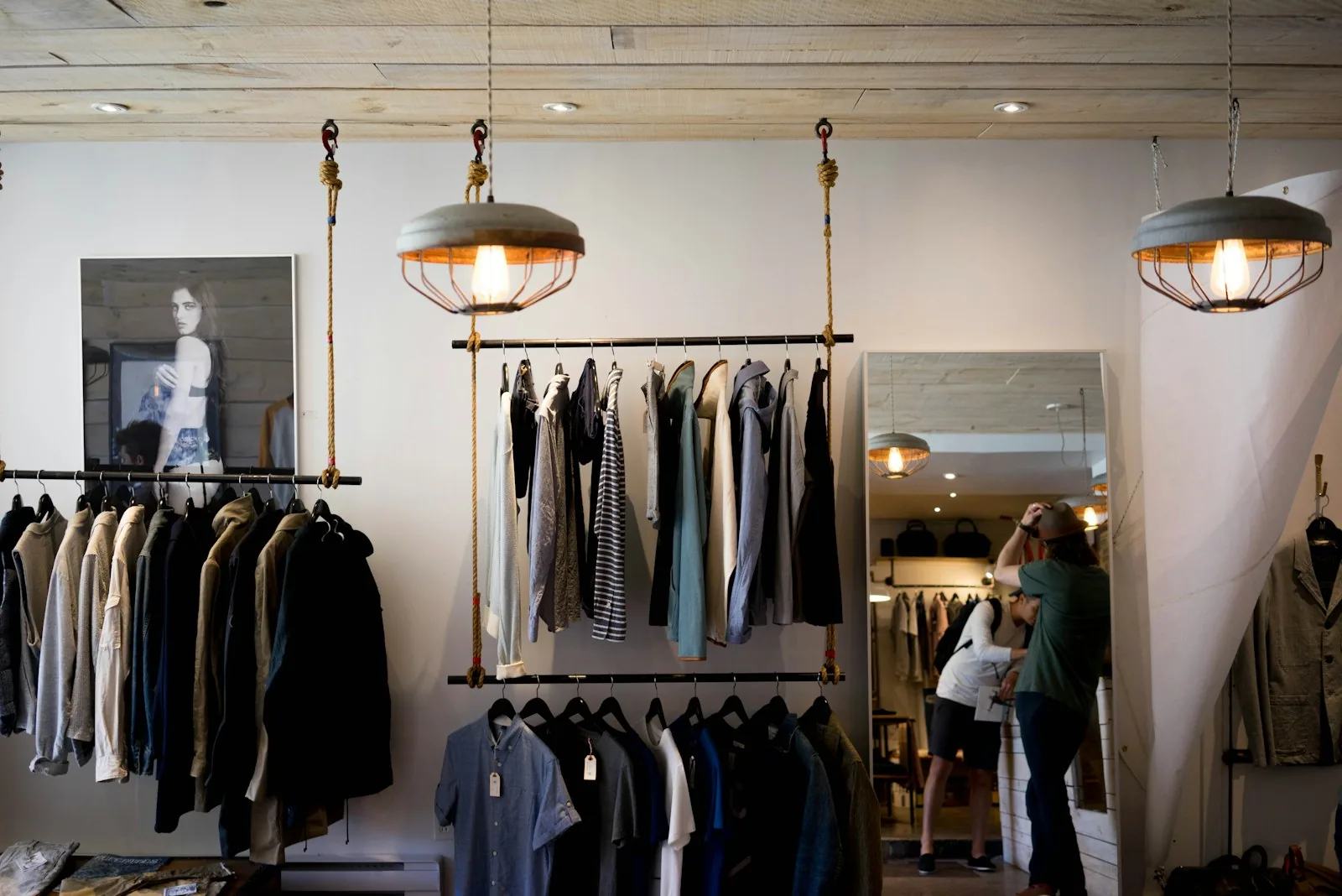 Fashion retail staff analyzing inventory data on digital devices